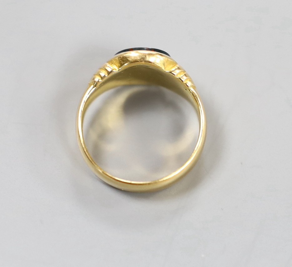A George V 18ct gold and bloodstone set signet ring, the stone with engraved initials, size M, gross 6.3 grams.